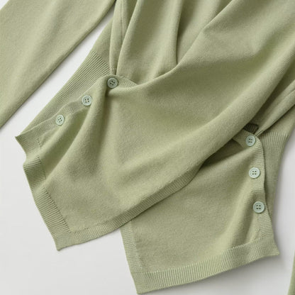 Long sleeved round neck asymmetrical hem knitted top